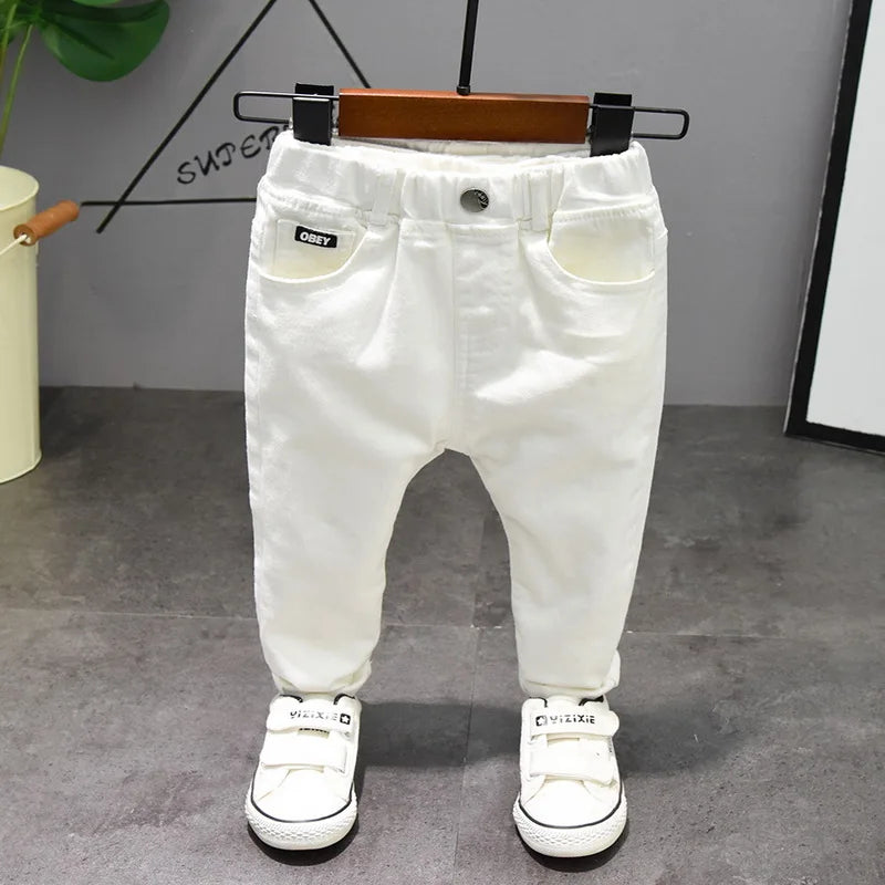 Children's Pants from Chorus Clothing in Pure White and Black. Straight jeans for students. Comfortable trousers for baby boys, perfect for Latin dance.