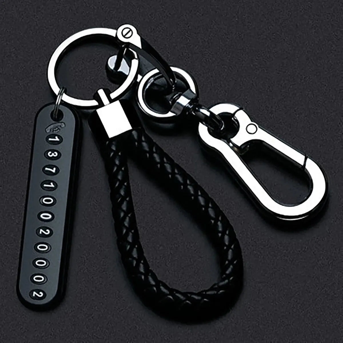 Trendy DIY mobile phone number plate keychain for men in punk style with woven leather rope. Perfect anti-lost accessory.