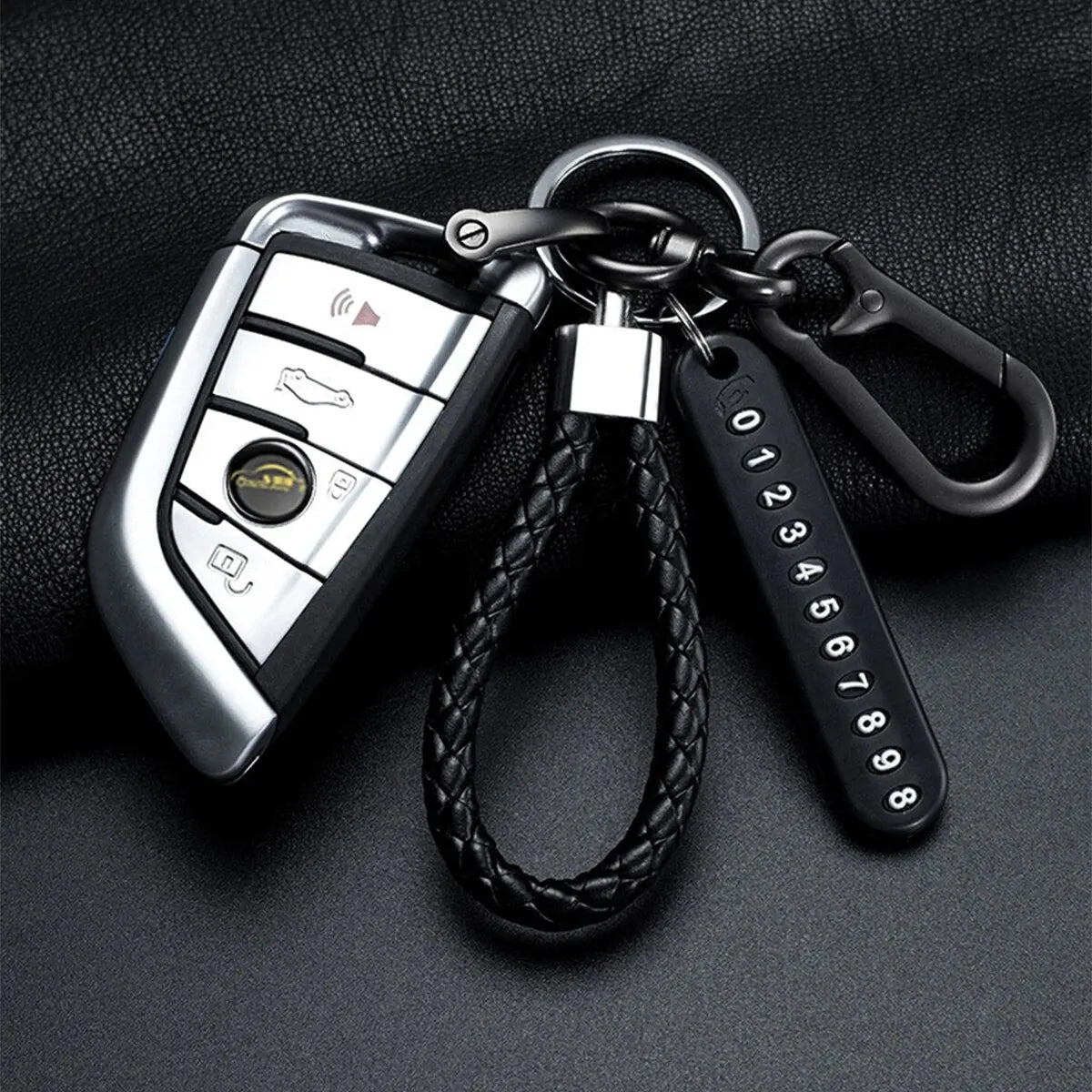 Trendy DIY mobile phone number plate keychain for men in punk style with woven leather rope. Perfect anti-lost accessory.