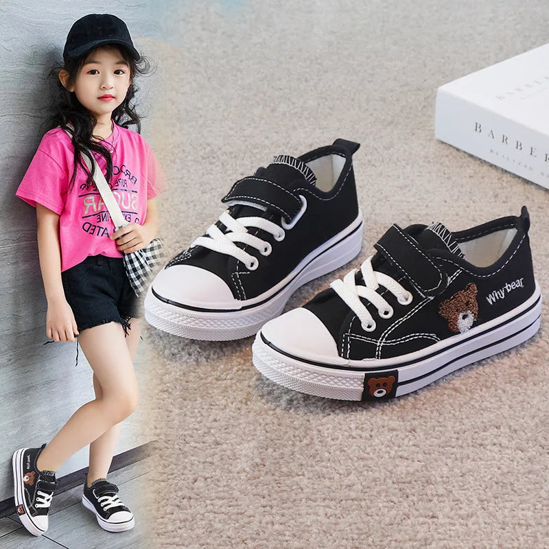 set of children's canvas shoes, specifically designed for girls and boys, featuring a cartoon bear design for a soft-bottomed casual sneaker.