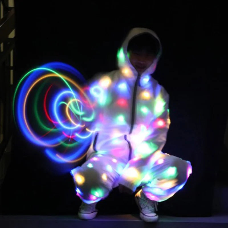 LED Light Up Rave Jacket for Adults and Kids. Perfect for dance performances and fancy dress. Features flashing LED lights and is waterproof, making it great for night runs and fun events!