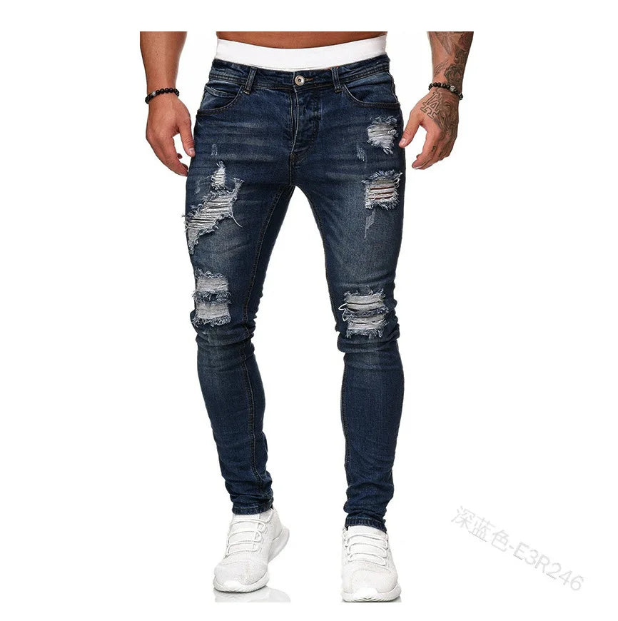 Men's slim-fit jeans with a ripped, vintage denim look. These stylish, ankle-length pants have distressed holes and a punk-inspired design.