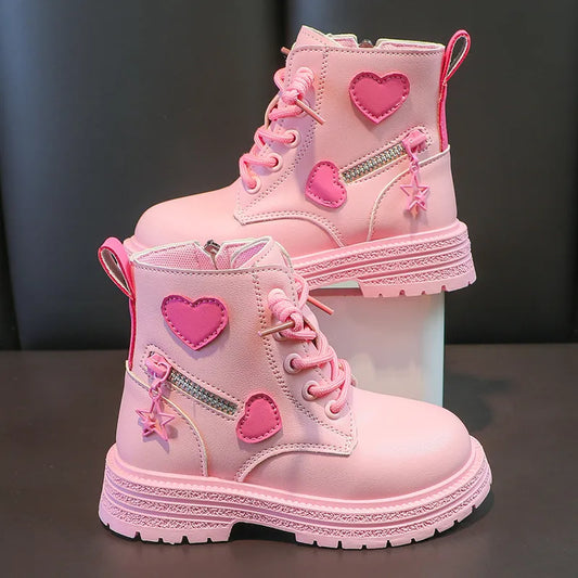 pair of fashionable rubber boots designed for girls, featuring a soft, pink sole and a princess-style round-toe design.