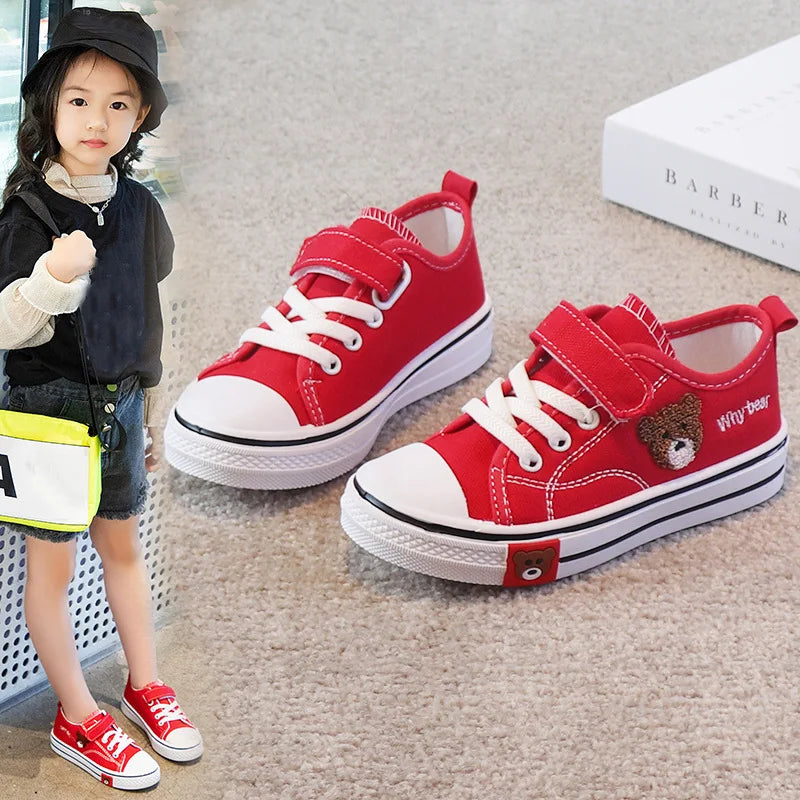 set of children's canvas shoes, specifically designed for girls and boys, featuring a cartoon bear design for a soft-bottomed casual sneaker.