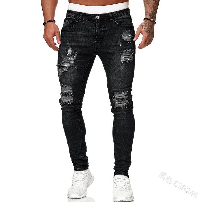 Men's slim-fit jeans with a ripped, vintage denim look. These stylish, ankle-length pants have distressed holes and a punk-inspired design.