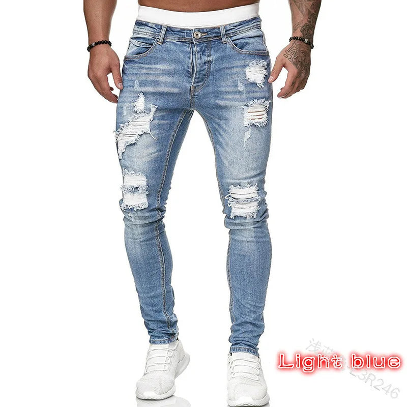 Men's slim-fit jeans with a ripped, vintage denim look. These stylish, ankle-length pants have distressed holes and a punk-inspired design.